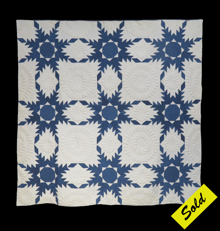 Q9102 Indigo and White Trapunto Touching Feathered Stars