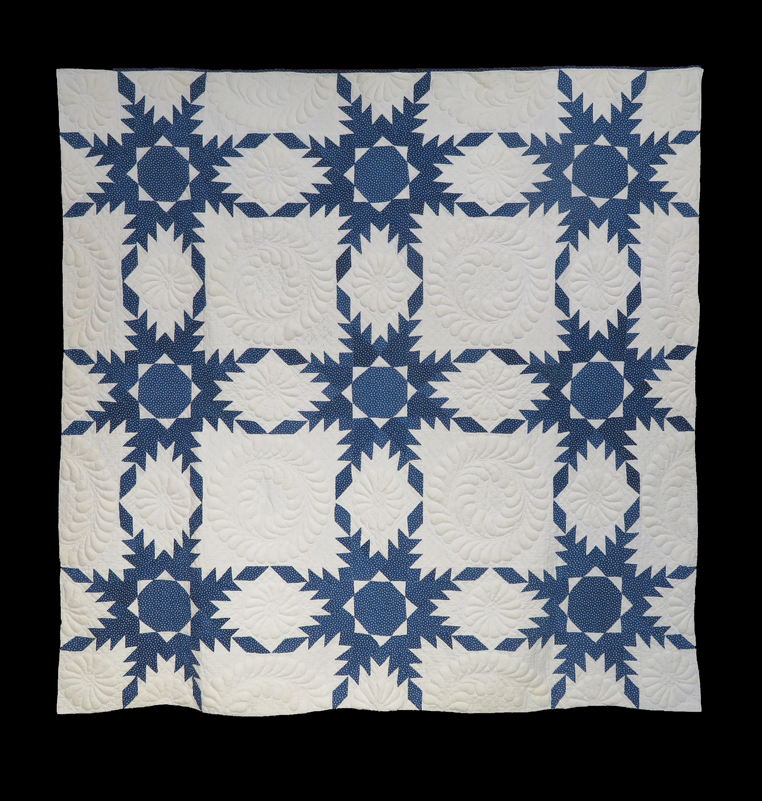 Q9102 Indigo and White Trapunto Touching Feathered Stars
